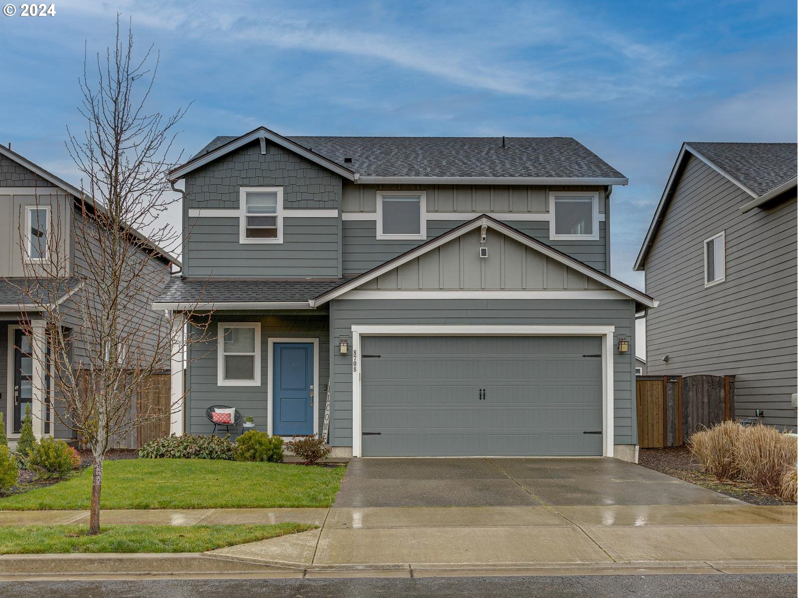 8708 North 3rd Way Ridgefield, WA 98642 - Photo 1 of 30 a view of a house with a yard and garage