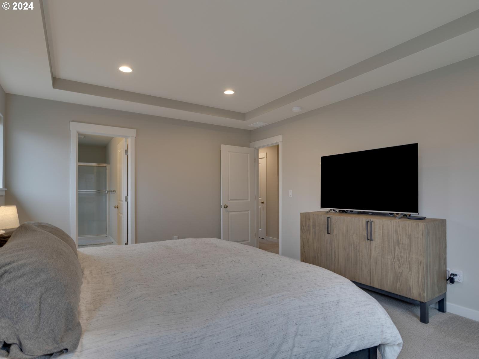 8708 North 3rd Way Ridgefield, WA 98642 - Photo 13 of 30 a bedroom with bed and flat screen tv