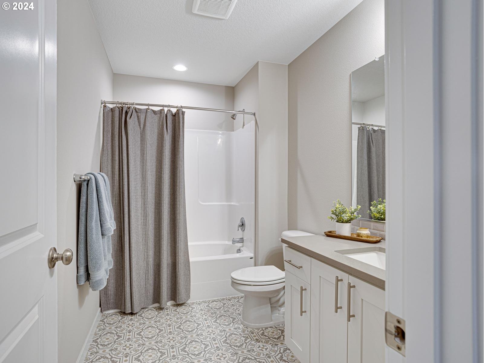 8708 North 3rd Way Ridgefield, WA 98642 - Photo 18 of 30 a bathroom with a granite countertop sink toilet and shower