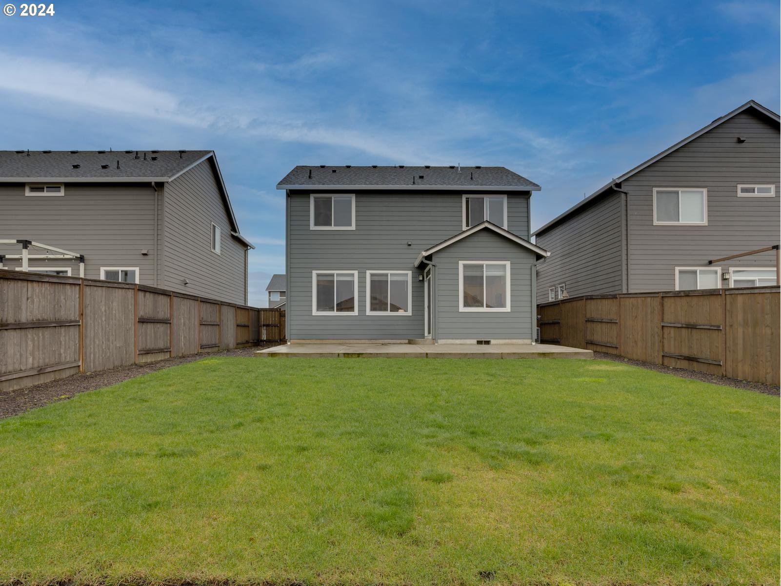 8708 North 3rd Way Ridgefield, WA 98642 - Photo 23 of 30 a front view of a house with yard