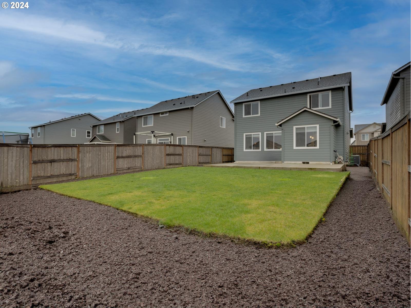 8708 North 3rd Way Ridgefield, WA 98642 - Photo 24 of 30 a front view of a house with a yard and garage