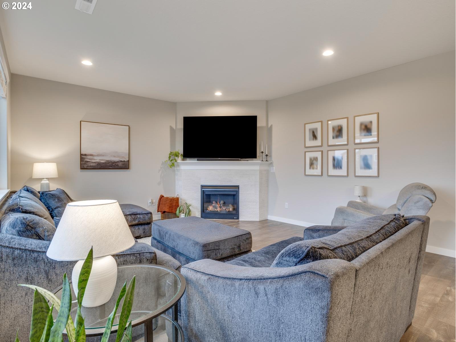 8708 North 3rd Way Ridgefield, WA 98642 - Photo 5 of 30 a living room with furniture and a flat screen tv