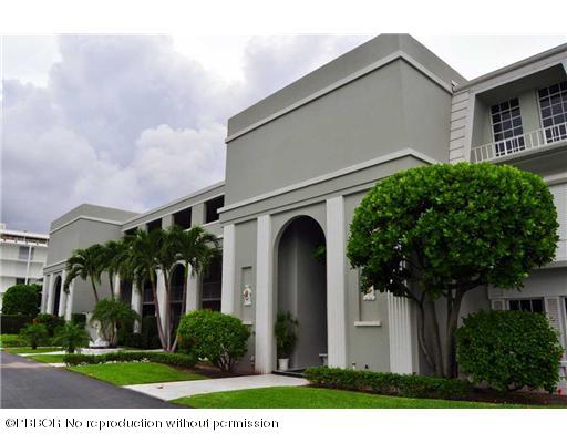 2165 Ibis Isle Road, Unit 15 Palm Beach, FL 33480 - Photo 2 of 14 front view of a house with a garden