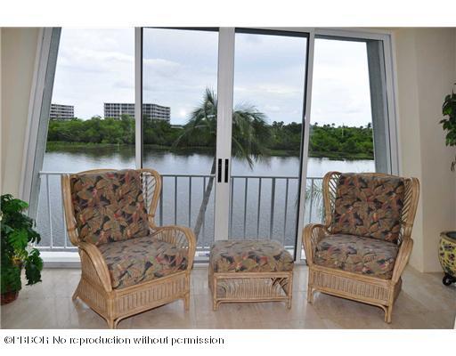 2165 Ibis Isle Road, Unit 15 Palm Beach, FL 33480 - Photo 5 of 14 a living room with furniture and a large window