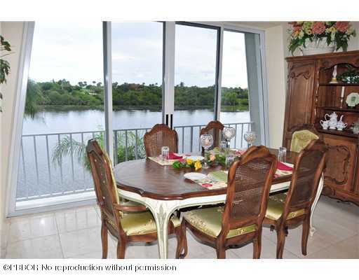 2165 Ibis Isle Road, Unit 15 Palm Beach, FL 33480 - Photo 6 of 14 a view of a dining room with furniture window and outside view