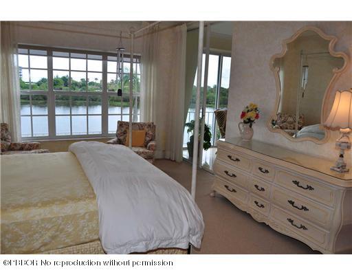 2165 Ibis Isle Road, Unit 15 Palm Beach, FL 33480 - Photo 10 of 14 a spacious bedroom with a bed and a dresser