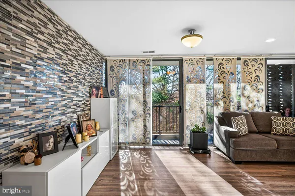 a kitchen with stainless steel appliances kitchen island granite countertop a refrigerator and a stove