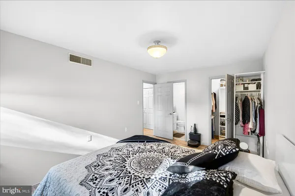 a bedroom with a bed and a closet