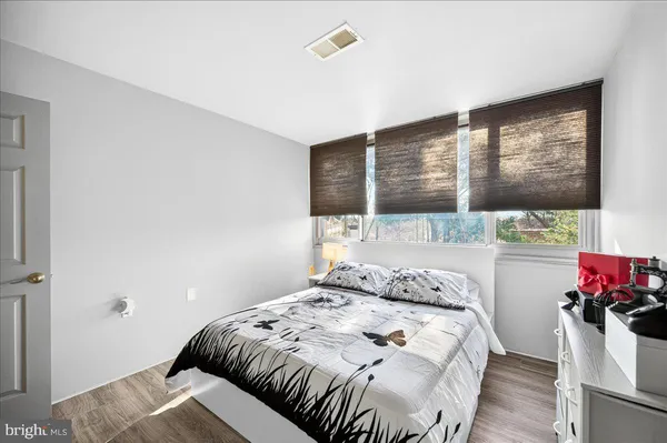 a bedroom with a bed and a closet