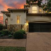 a front view of a house with a garage