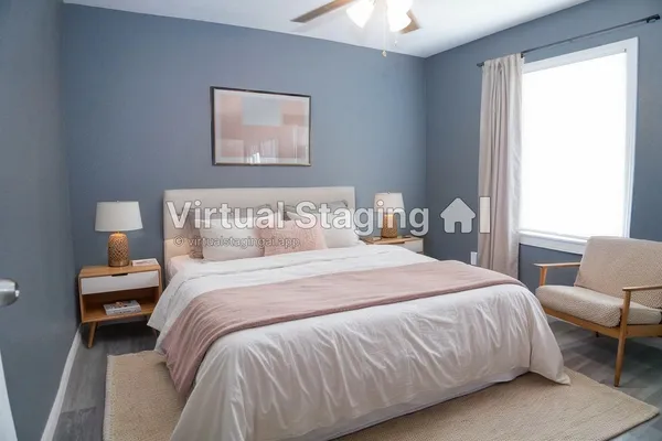 a bedroom with bed and a window