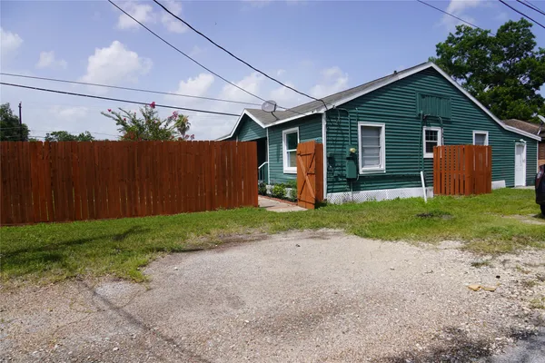 a view of road and house in the background