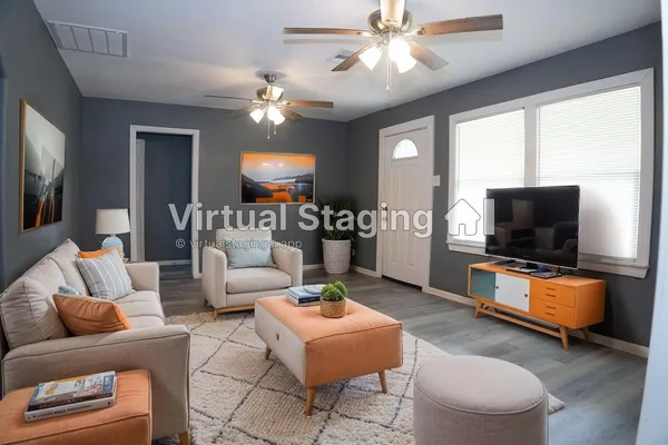 a living room with furniture and a flat screen tv