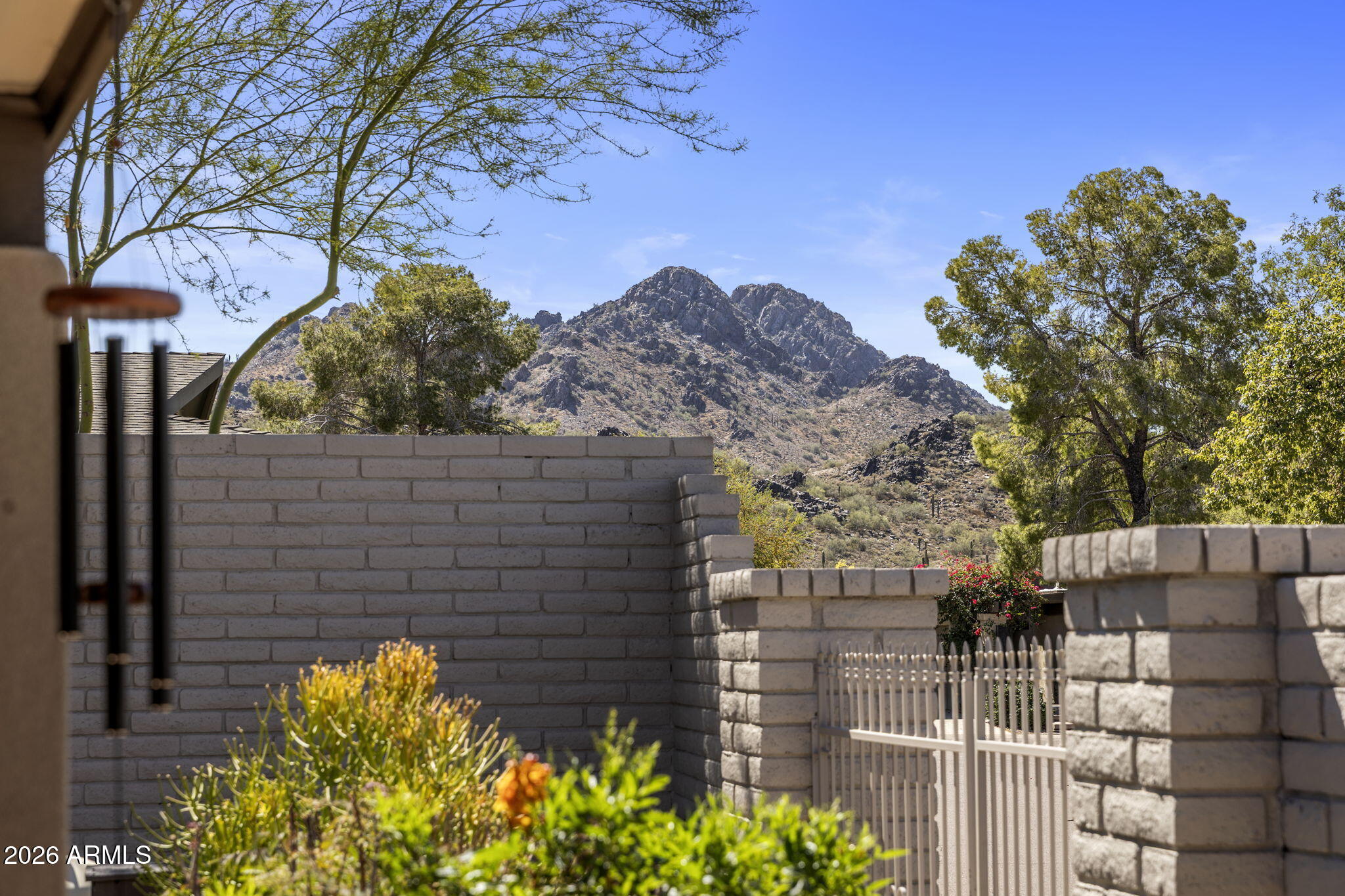 2901 East Las Rocas Drive Phoenix, AZ 85028 - Photo 15 of 47 a yellow building with trees in front of it