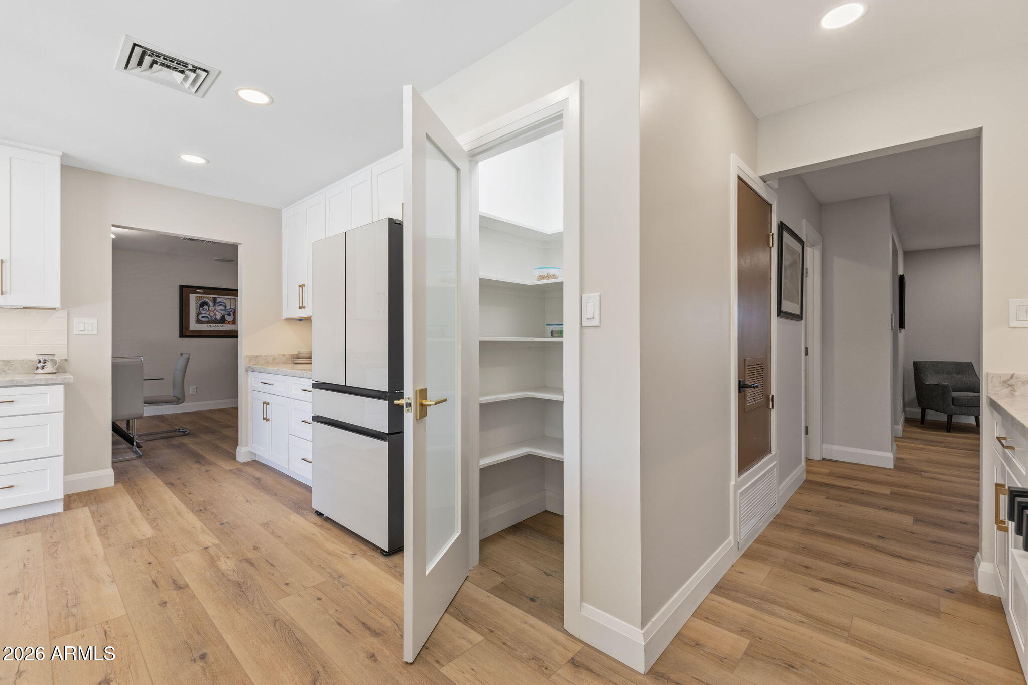 2901 East Las Rocas Drive Phoenix, AZ 85028 - Photo 18 of 47 a view of a hallway view with wooden floor and staircase
