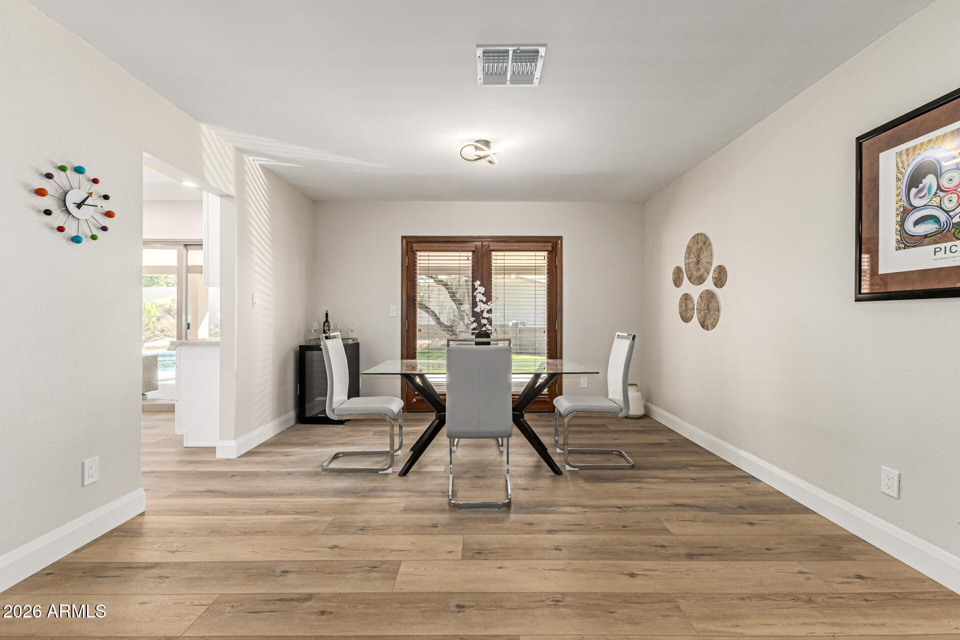 2901 East Las Rocas Drive Phoenix, AZ 85028 - Photo 21 of 47 a dining room with wooden floor and windows