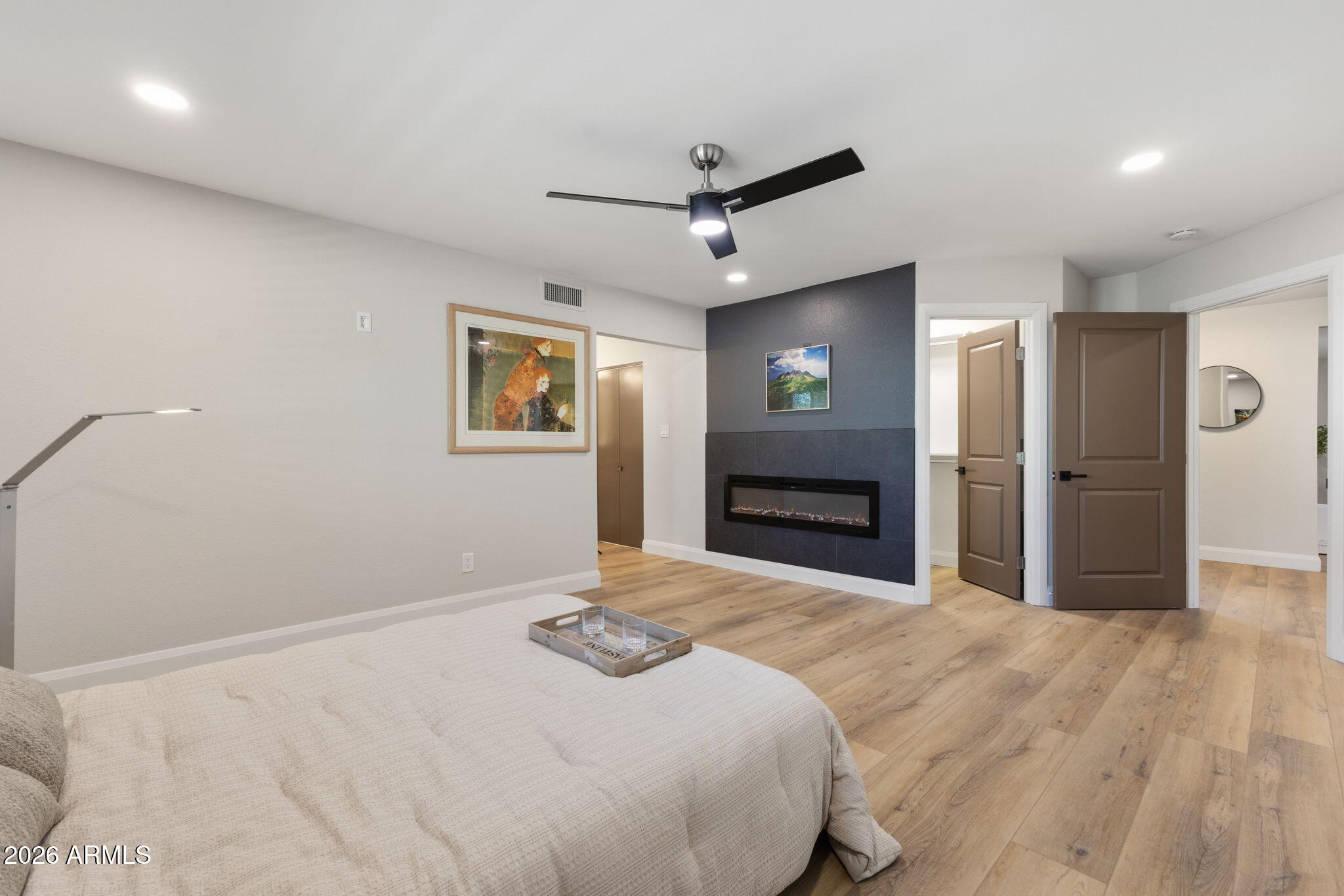 2901 East Las Rocas Drive Phoenix, AZ 85028 - Photo 26 of 47 a bedroom with a bed and a flat screen tv