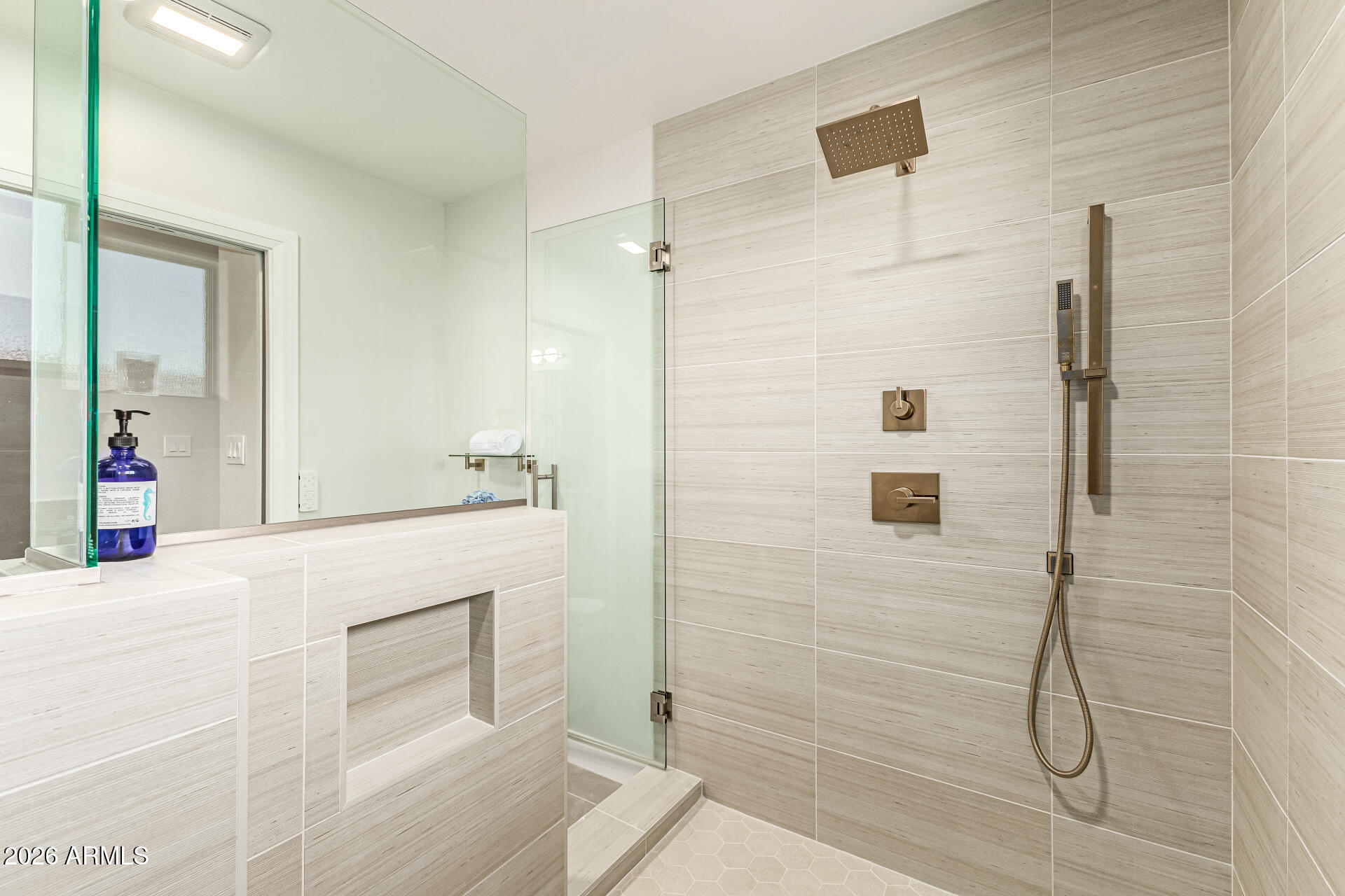 2901 East Las Rocas Drive Phoenix, AZ 85028 - Photo 28 of 47 a bathroom with a sink a mirror and shower