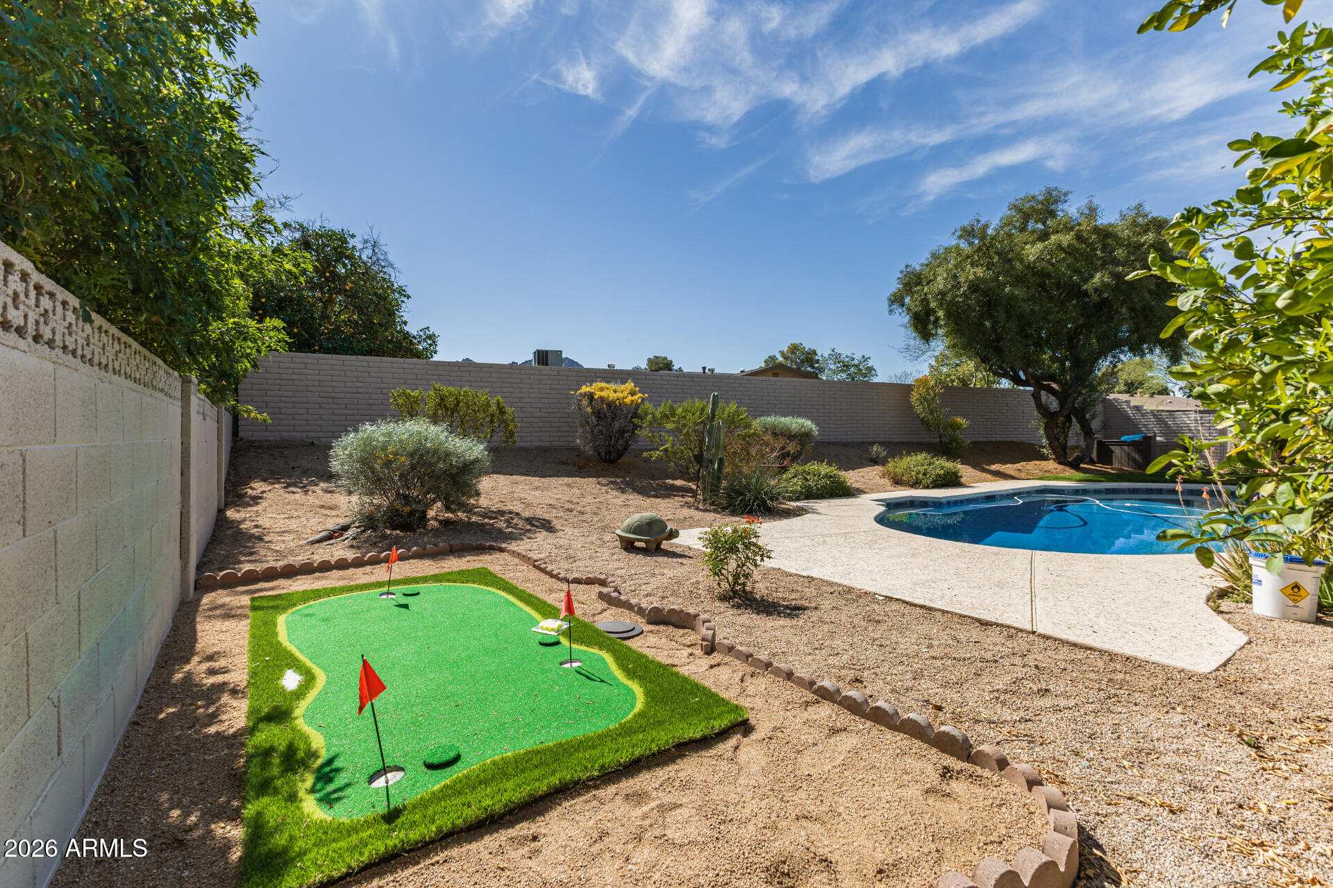 2901 East Las Rocas Drive Phoenix, AZ 85028 - Photo 39 of 47 a view of backyard with swimming pool and outdoor seating