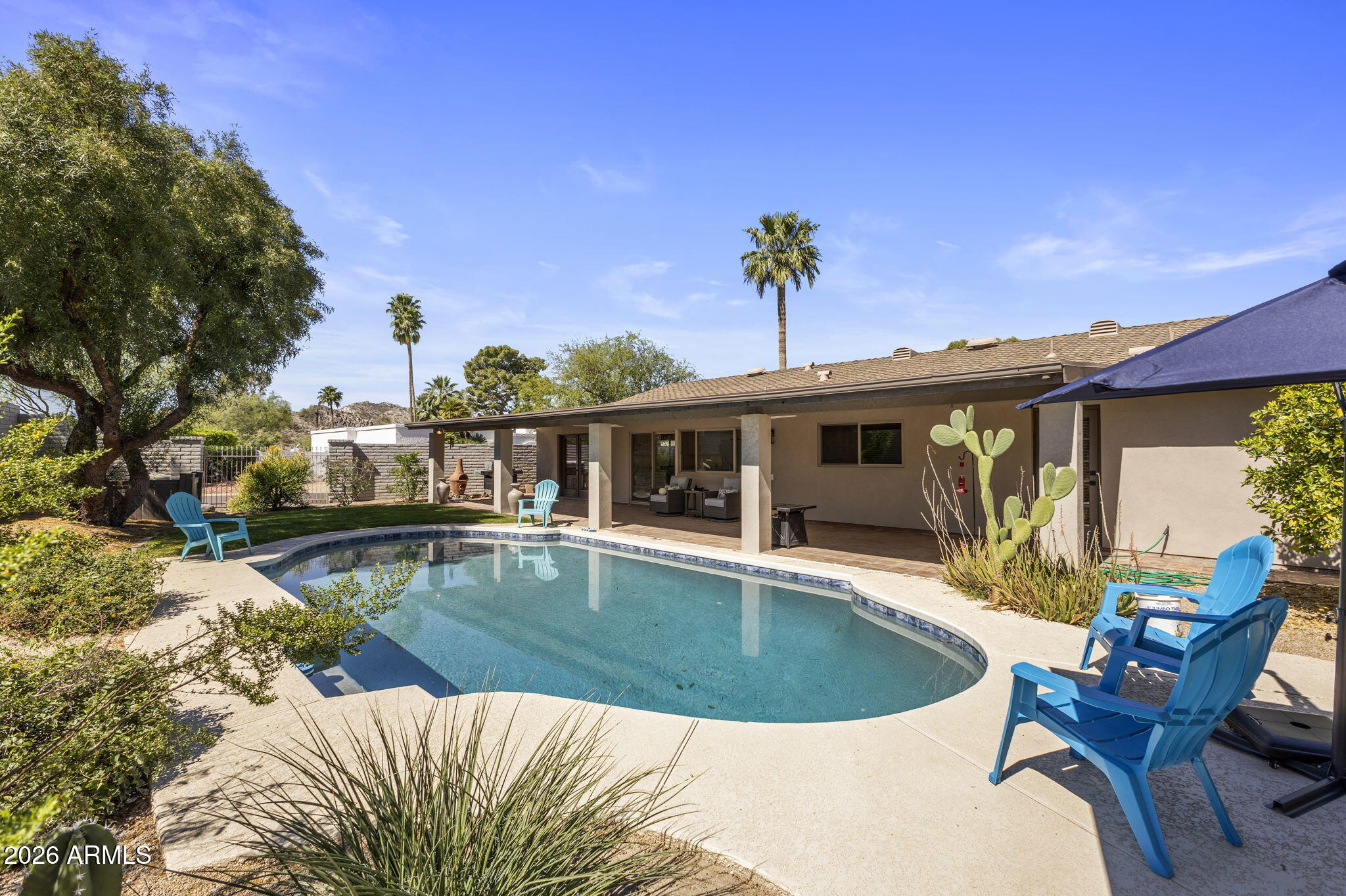 2901 East Las Rocas Drive Phoenix, AZ 85028 - Photo 41 of 47 a view of a house with swimming pool and sitting area