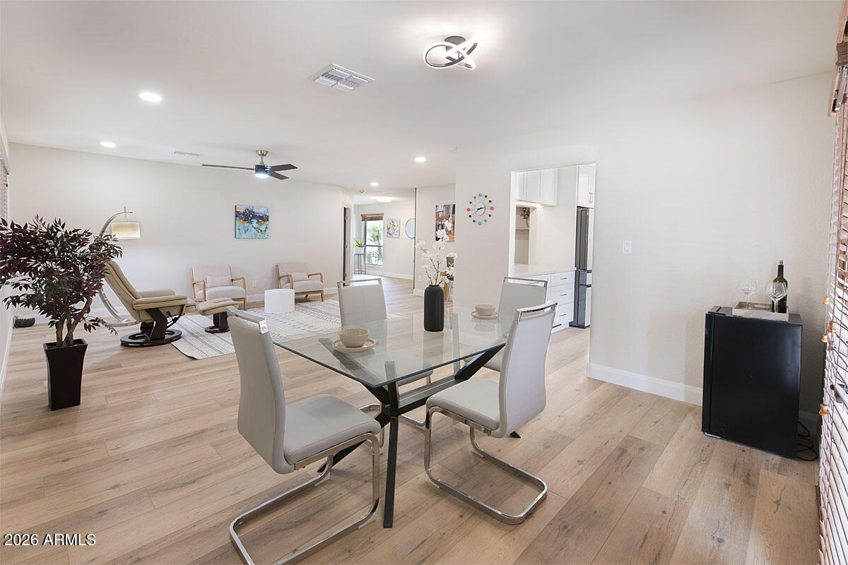 2901 East Las Rocas Drive Phoenix, AZ 85028 - Photo 5 of 47 a view of a dining room with furniture and wooden floor