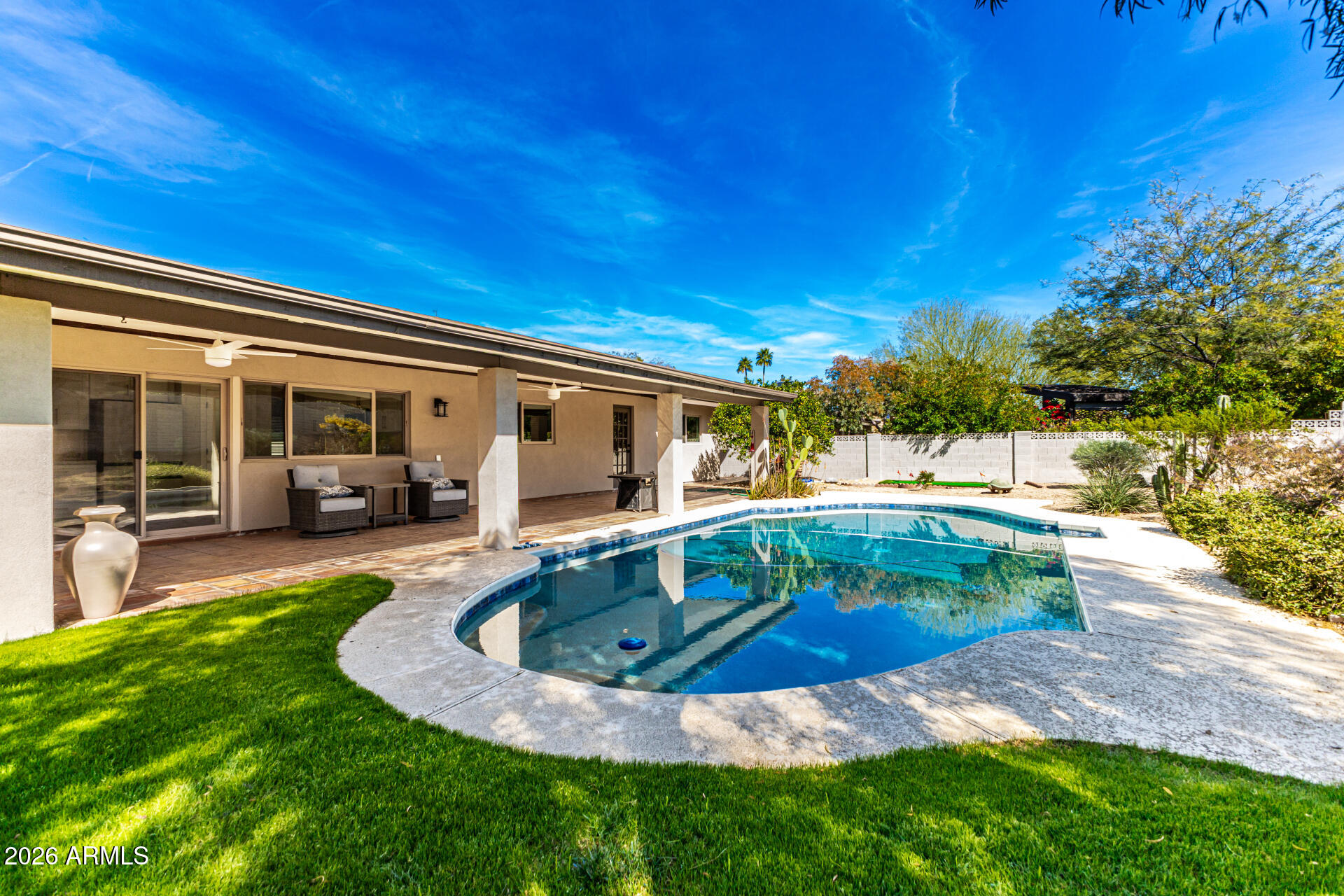 2901 East Las Rocas Drive Phoenix, AZ 85028 - Photo 6 of 47 a view of swimming pool with a patio