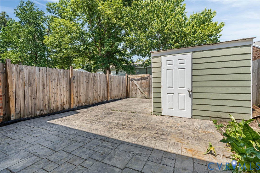 10050 Purcell Road Richmond, VA 23228 - Photo 25 of 26 a view of backyard with wooden fence