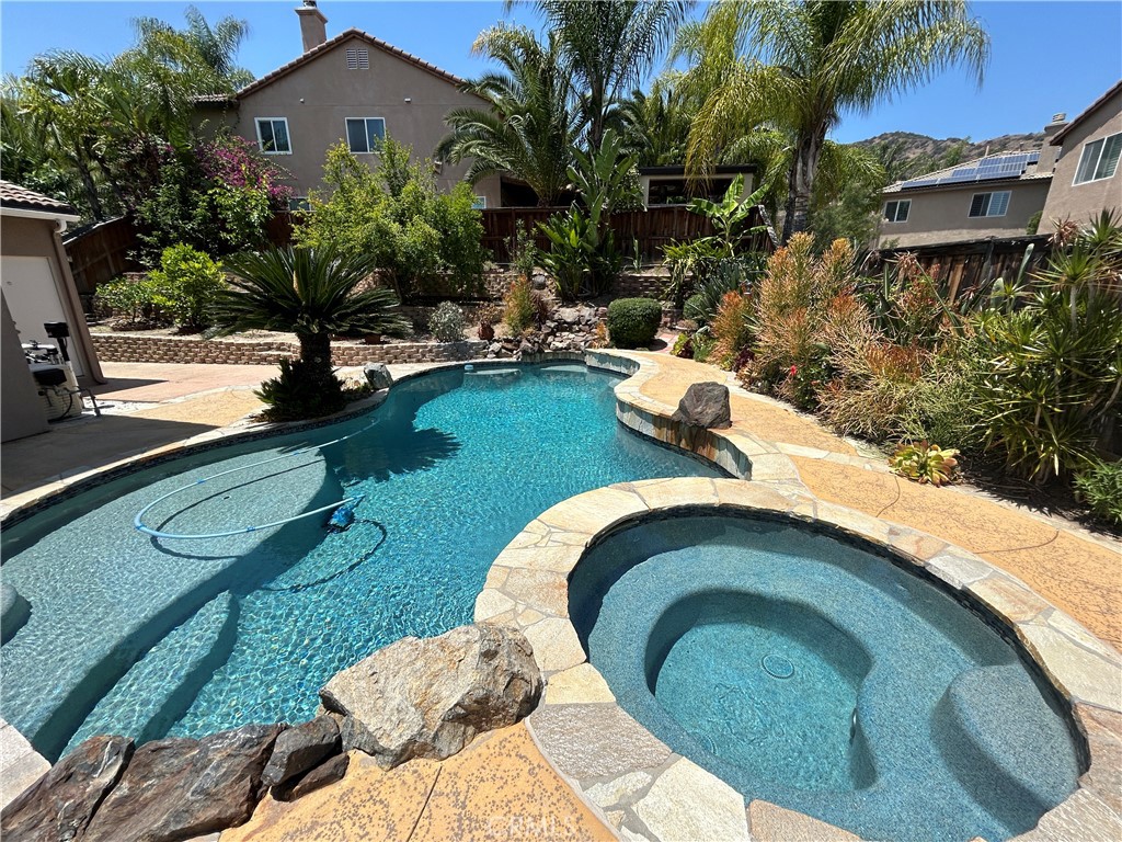 8634 Hunt Canyon Road Corona, CA 92883 - Photo 27 of 31 a view of a swimming pool with a patio