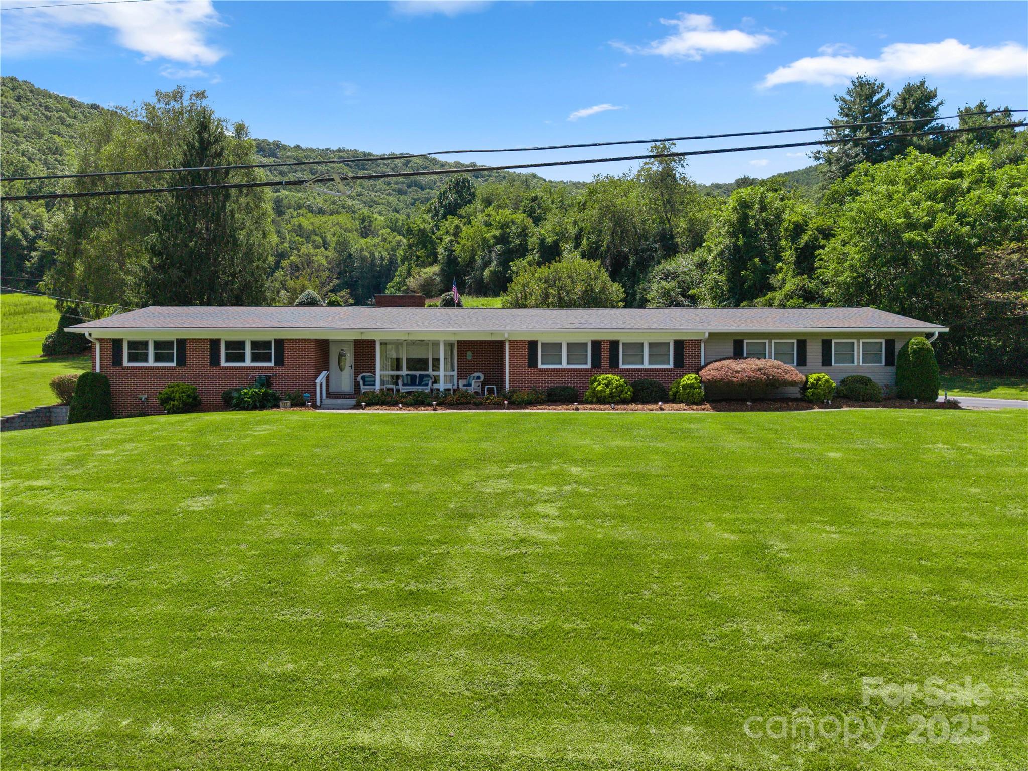 a view of a house with a big yard