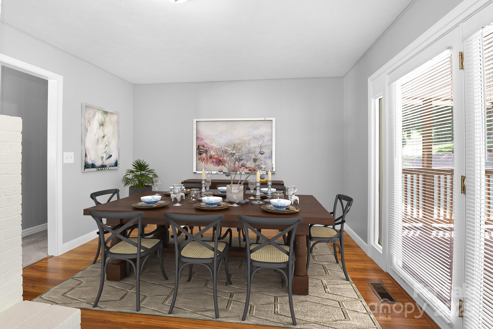 111 Curtis Creek Road Candler, NC 28715 - Photo 11 of 28 a view of a dining room with furniture window and wooden floor
