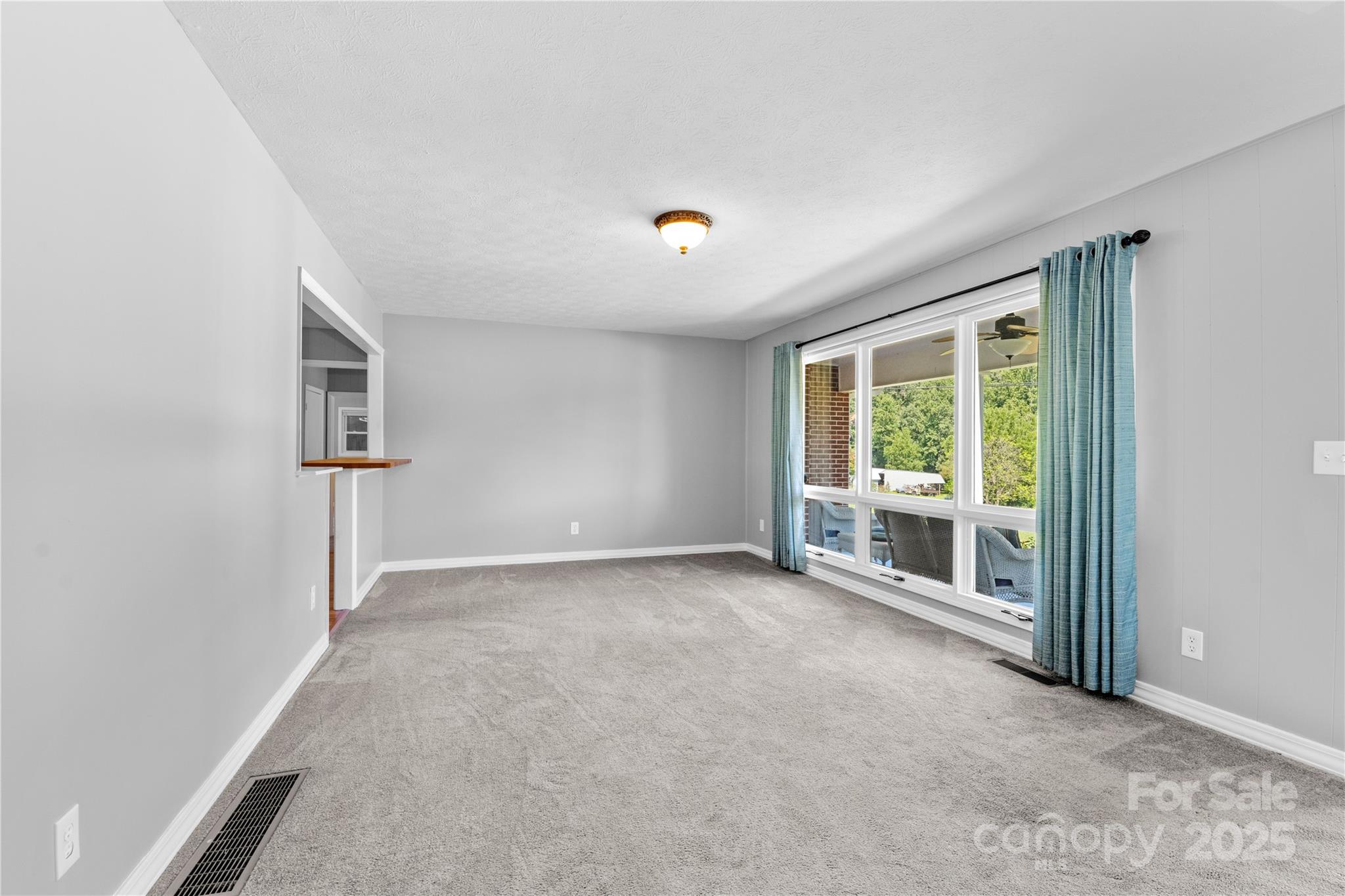 111 Curtis Creek Road Candler, NC 28715 - Photo 12 of 28 an empty room with windows