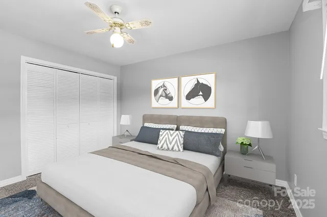 a bedroom with a bed and a painting on the wall