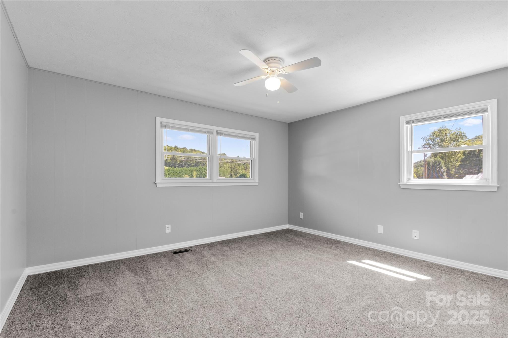 111 Curtis Creek Road Candler, NC 28715 - Photo 17 of 28 a view of an empty room with a window
