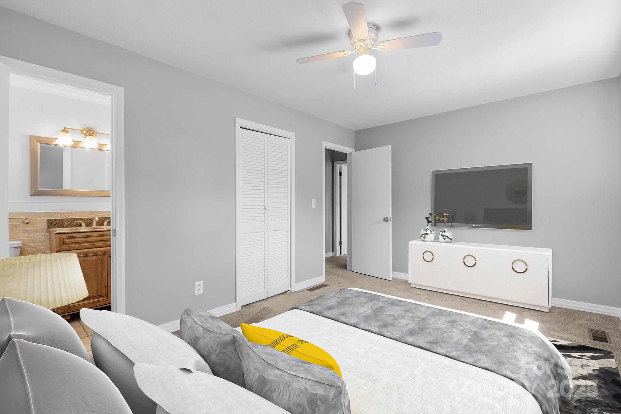 111 Curtis Creek Road Candler, NC 28715 - Photo 20 of 28 a bedroom with a bed and a flat screen tv