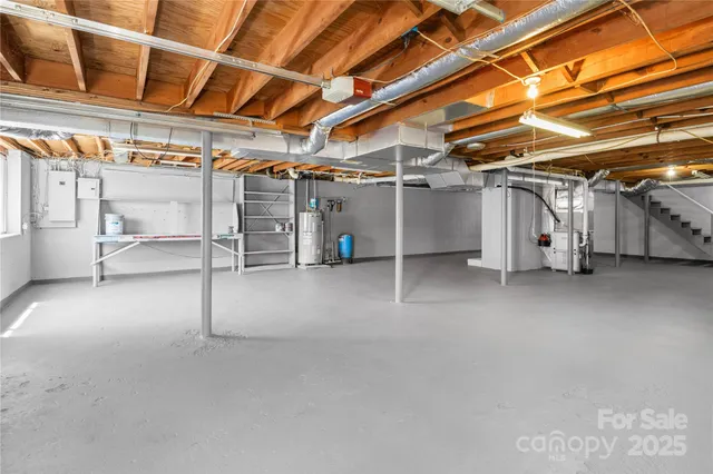 a view of empty room with wooden ceiling