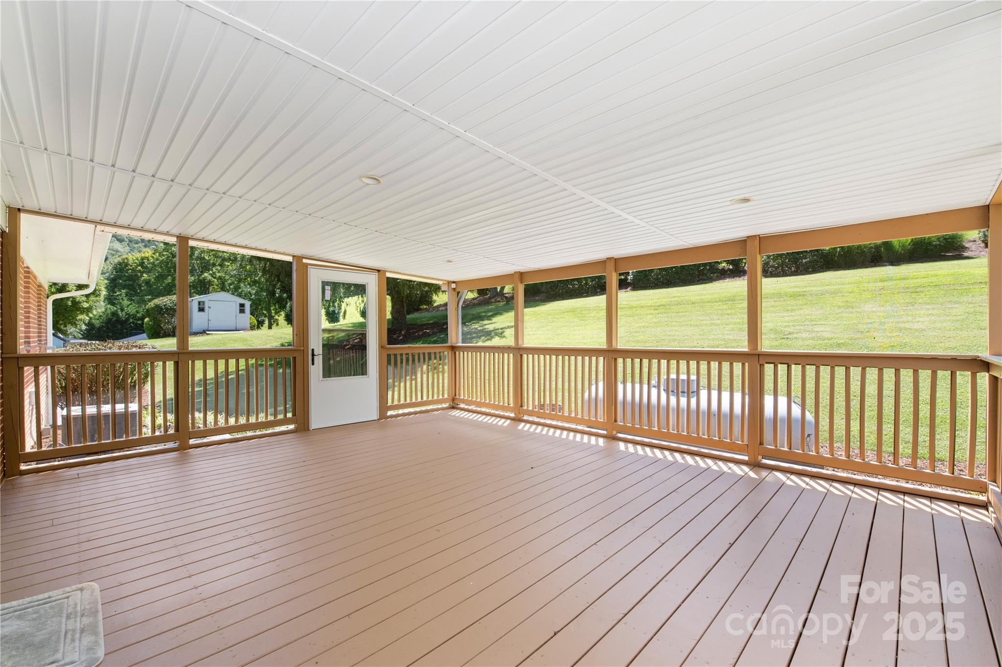 111 Curtis Creek Road Candler, NC 28715 - Photo 24 of 28 a view of wooden deck with a yard