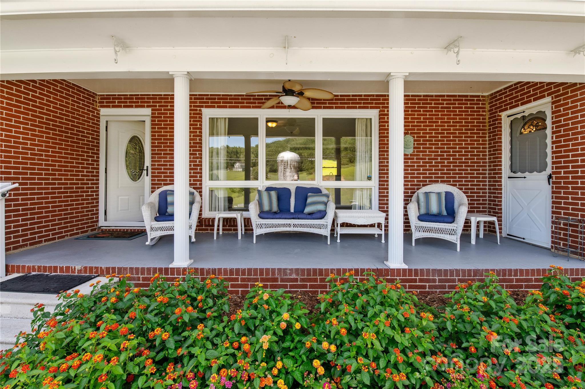 111 Curtis Creek Road Candler, NC 28715 - Photo 25 of 28 a lobby with furniture and floor to ceiling window