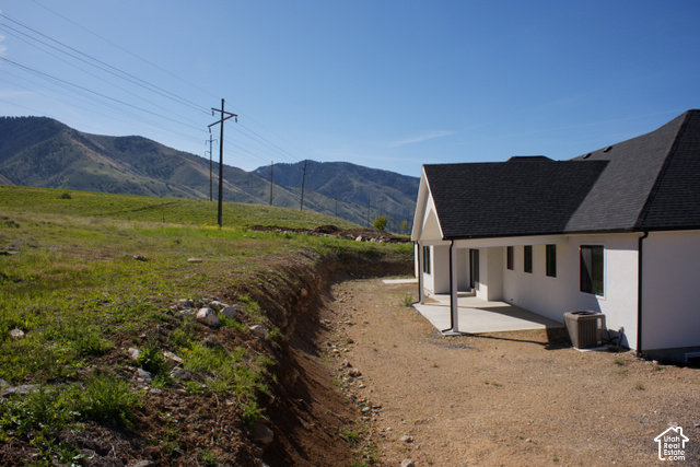 3504 North Sun Dancer Loop Logan, UT 84341 - Photo 58 of 59 White exterior with black-framed windows and a covered concrete patio