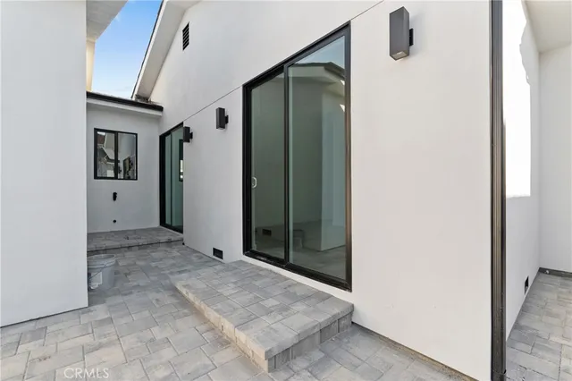a view of a bathroom with a shower and a sink