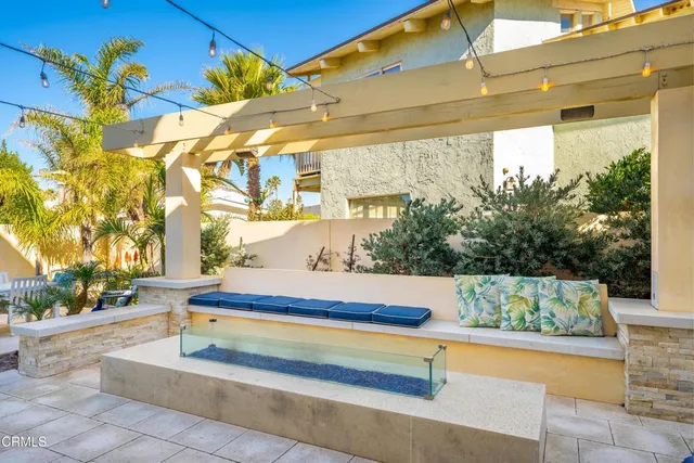 a view of a patio with a table and chairs