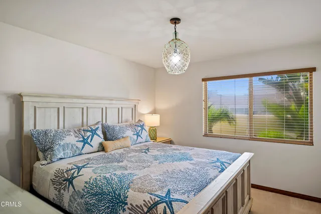 a bed room with furniture and a wooden floor