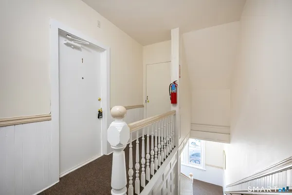 a view of entryway with wooden floor