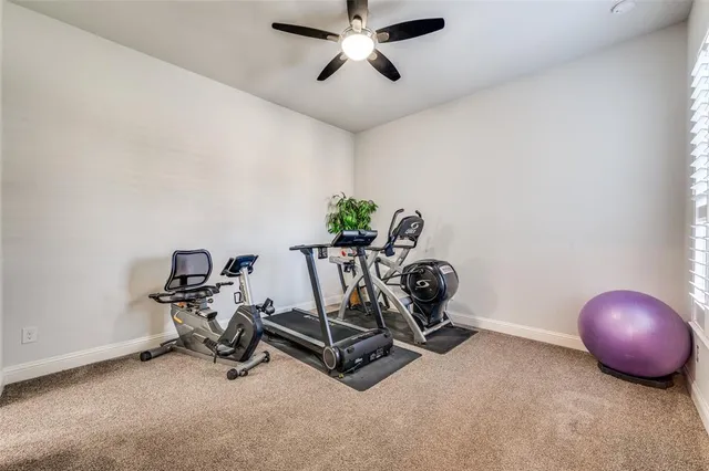 a room with a table and gym equipment