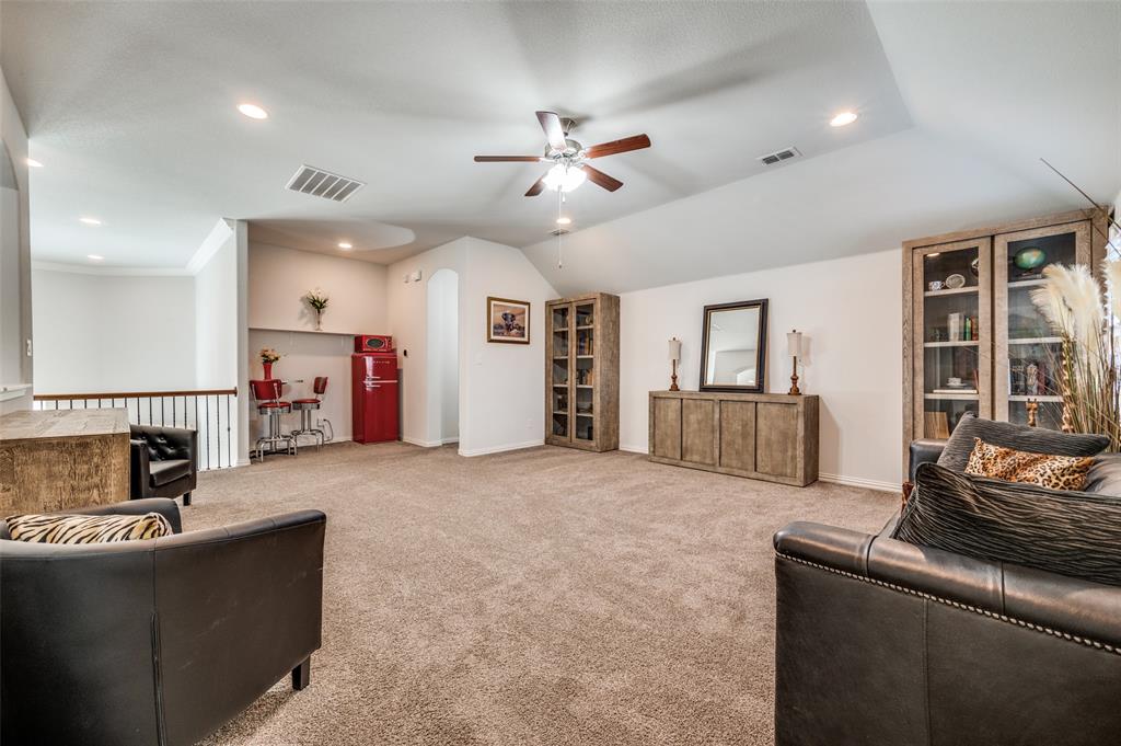 2631 Seabiscuit Road Celina, TX 75009 - Photo 21 of 40 a living room with furniture and kitchen view