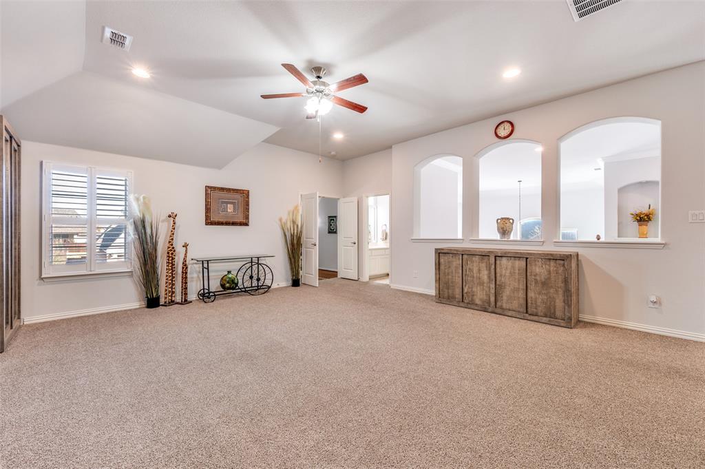 2631 Seabiscuit Road Celina, TX 75009 - Photo 22 of 40 a view of a livingroom with furniture and a ceiling fan