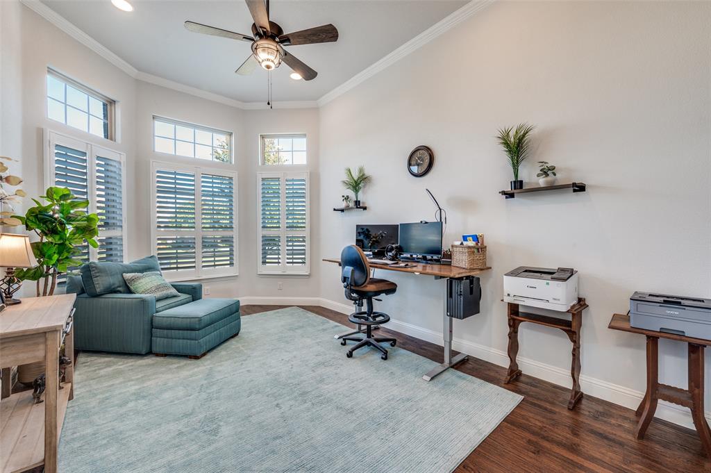 2631 Seabiscuit Road Celina, TX 75009 - Photo 4 of 40 a view of a livingroom with workspace and a window