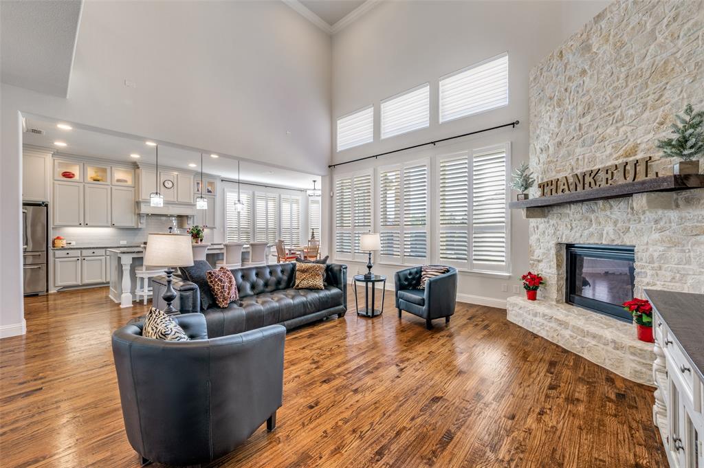 2631 Seabiscuit Road Celina, TX 75009 - Photo 10 of 40 a living room with fireplace furniture and a wooden floor
