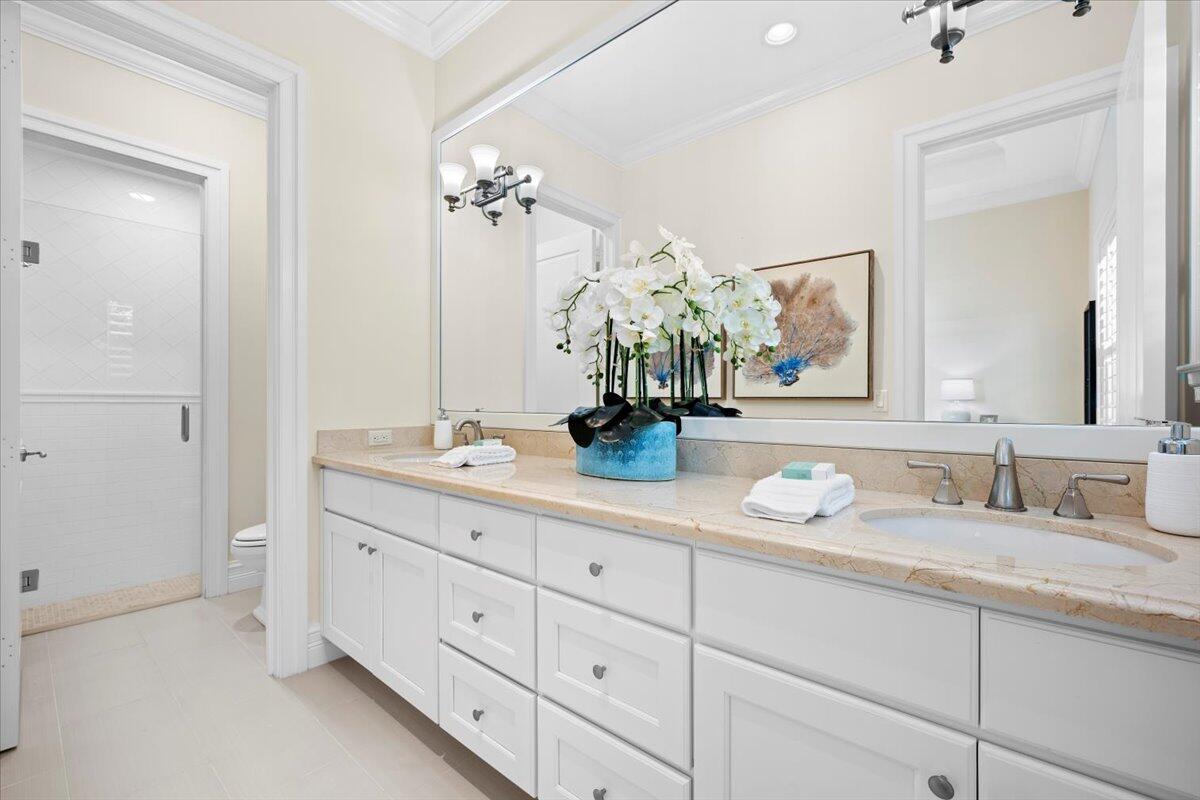 5775 Lady Luck Road Palm Beach Gardens, FL 33418 - Photo 23 of 45 a bathroom with double sink and a mirror