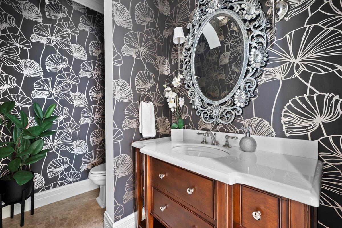 5775 Lady Luck Road Palm Beach Gardens, FL 33418 - Photo 28 of 45 a bathroom with a sink and a mirror