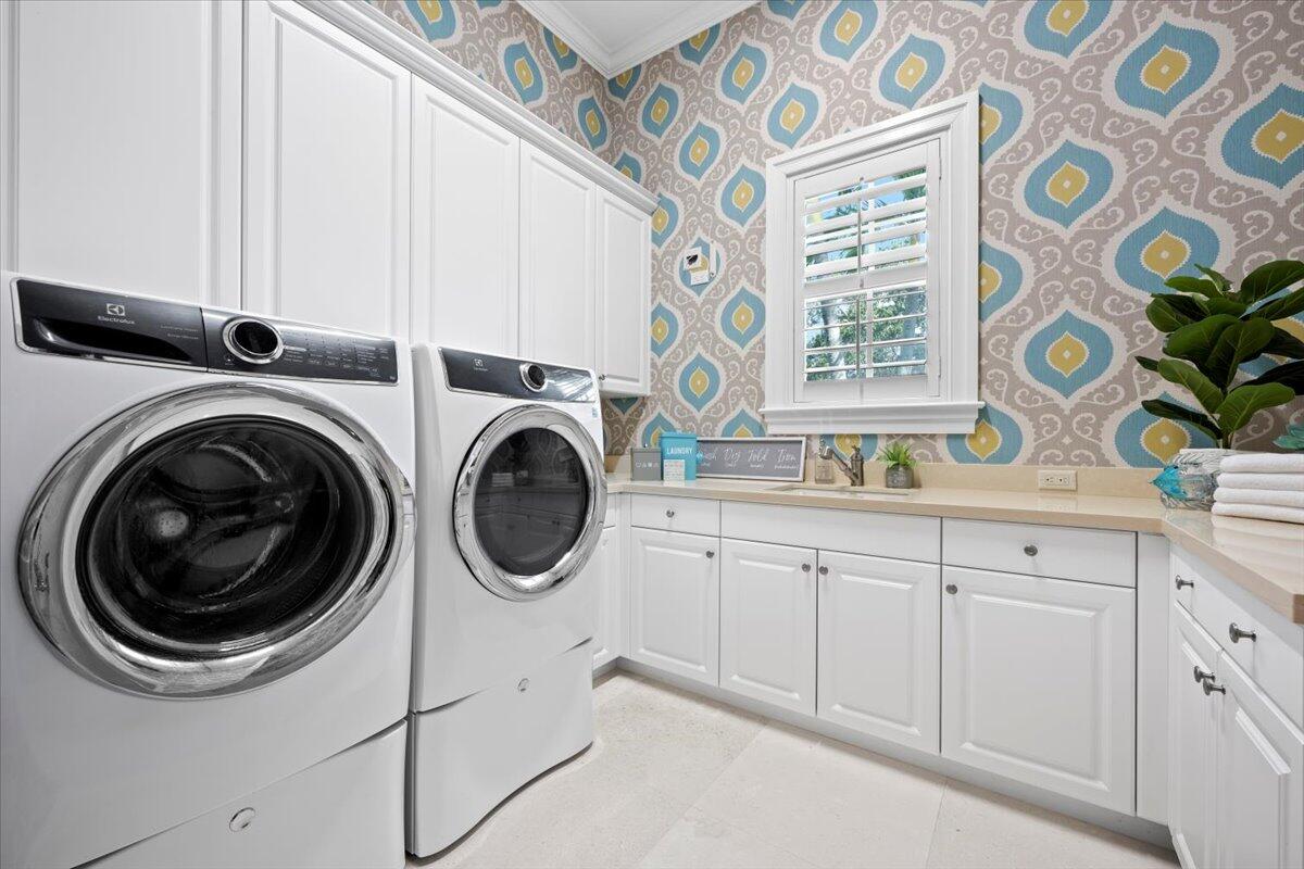 5775 Lady Luck Road Palm Beach Gardens, FL 33418 - Photo 29 of 45 a utility room with multiple dryer and washer